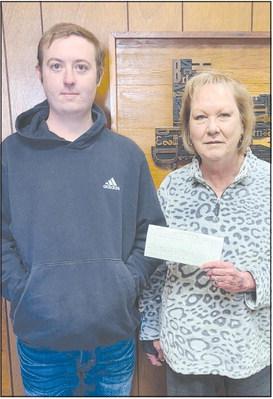 FOOTBALL CONTEST WINNER Paxton Denton was the grand prize winner of the Herald’s annual football contest, with an impressive 70 points. As the winner, he received four tickets to the Goodyear Cotton Bowl at AT&amp;T Stadium in Arlington Jan. 2, and $200 in expense money. Pictured with him is Herald publisher Mary Dudley.