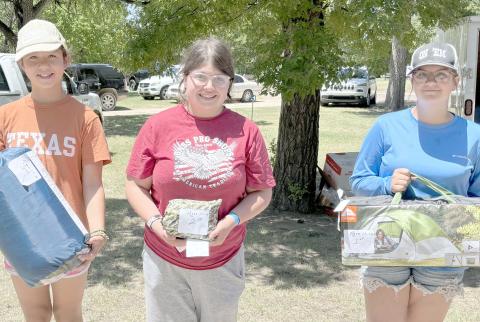 Young anglers showed up to compete in the Children’s Fishing Tournament at Lake Fryer and Wolf Creek Park at the beginning of June. The annual fishing tourney is hosted by the Wolf Creek Park Improvement Board. The top prize winners in the ages 11-14 category were, from left, Annalise Cotta (third place), Autumn Gonzales (second place), and Khole Scott (first place).
