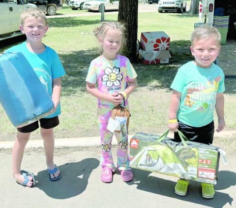 Kids turned out in droves for the Children’s Fishing Tournament at Lake Fryer and Wolf Creek Park at the beginning of June. The top prize winners in the ages 3-6 category were, from left, Granger Mills (third place), Emmalyn Lamb (second place), and Jesus Salazar (first place).