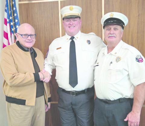 Ed Hanna was sworn in on Dec. 5 as the City of Perryton’s new Fire Department Chief. The brief ceremony came at the end of the retirement reception for outgoing chief Paul Dutcher. Pictured are, from left, Perryton Mayor Kerry Symons, Hanna, and Dutcher.