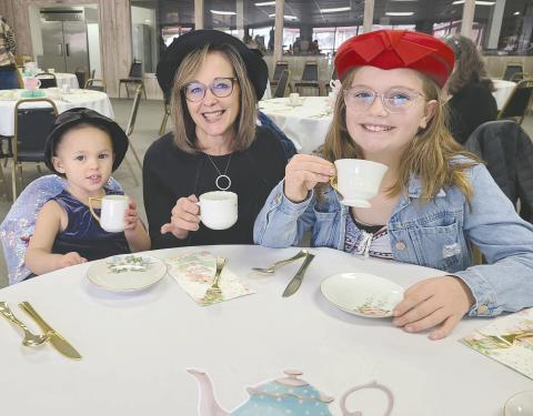 TEA AND SOPHISTICATION Parents, kids, and grandparents of all ages dropped by the Museum of the Plains on Sunday afternoon to enjoy an old-fashioned afternoon tea party. Some 45 residents picked out fancy hats to wear and enjoyed tea, punch, finger sandwiches, cookies, and plenty of good company, as well as checking out the museum’s new display of vintage dolls. Pictured are, from left, Alexia Campbell, age 2, grandma Rhonda Appelhans, and Brystol Appelhans, 10.