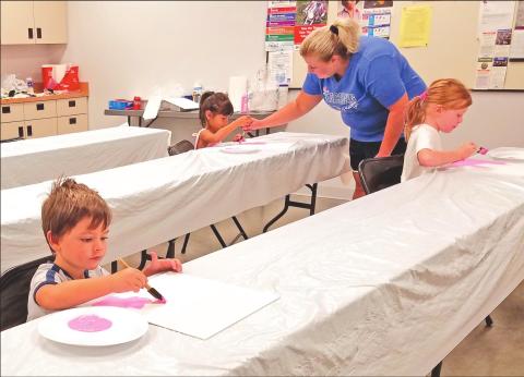 PEEWEE PUPILS PAINTING PINK PAGES