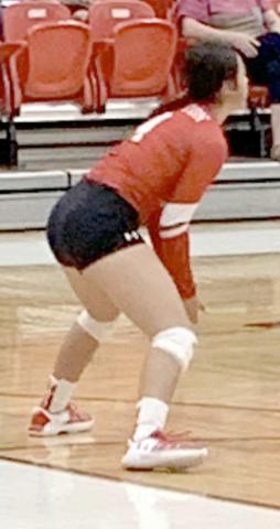 GAME ACTION—Libero #4 Genesis Flores slides to the strong side for one of her 30 digs in the loss to Wildorado.
