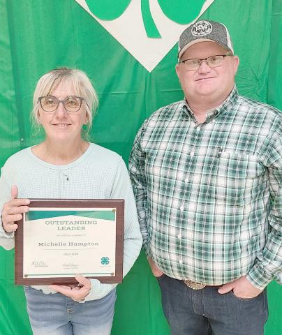 OUTSTANDING LEADER AWARD— Ochiltree County 4-H held their annual awards ceremony at the Ochiltree County Expo Center on Oct. 14. The award for Outstanding Leader went to Michelle Hampton for her leadership with the Horse Project. Pictured with her is 4-H Parents Association President Buddy Young.