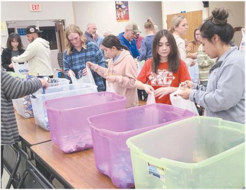 Local volunteers for Snack Pak 4 Kids gathered Monday evening at Williams Intermediate Elementary School to pack snacks for hungry kids. Volunteers meet every few weeks to pack snack bags with nutritious food to help food-insecure students stave off hunger. The Snack Pak 4 Kids program has been distributing over 100 packs every week to kids in Perryton.