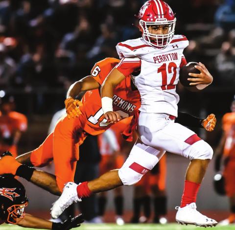 DUMAS BLANKS RANGERS Ranger Abraham Hernandez (Junior, #12) looks to break another tackle during a long scamper down the field early in the 4th quarter against the Dumas Demons. The team travelled to Dumas in their third game of the season. See story for more information. (Photo by David Erickson)