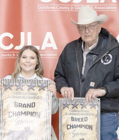 At the Ochiltree County Junior Livestock Show and Sale on Jan. 1617, Avery Swenhaugen took home the award for Grand Champion Swine. Her animal was purchased by Broken Arrow Crop Insurance. Pictured are, from left, Avery Swenhaugen and Larry Schickedanz. ( Photo Credit: Hailey Clark of Hailey Renee Photography)
