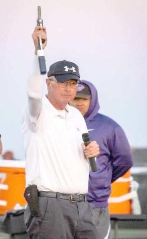 Kelly Brown prepares to fire the starting pistol