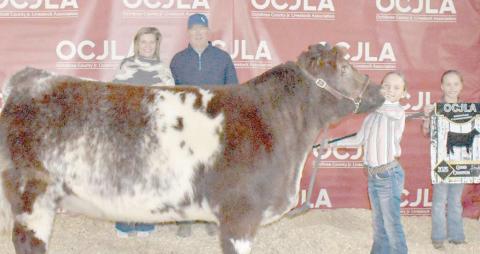 At the Ochiltree County Junior Livestock Show and Sale on Jan. 17-18, Gabby Heck took home the award for Grand Champion Heifer. Her animal was purchased by Steven and Paige Waide. Pictured are, from left, Paige Waide, Steven Waide, Gabby Heck, and Izzy Heck. ( Photo credit: Morgan Dudley)
