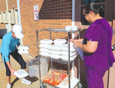 VOLUNTEERS HELPING NEIGHBORS