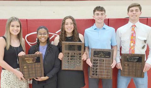 PHS TRACK STARS BRING HOME AWARDS— Perryton High School’s track team was honored on Moay 1 at the Perryton High School All Sports Awards Banquet. Pictured are, from left, Kelsie Lossie and Tiana Hill, girls Fighting Heart award winners; Mackenzi Stokes, girls team MVP; Daxton Rigdon, boys team MVP; and Tad Pshigoda, boys Fighting Heart award winner.