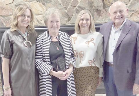 The family of Cynthia Symons turned out for the annual Perryton-Ochiltree Chamber of Commerce Banquet to congratulate her after being named the Citizen of the Year. Pictured are, from left, Melanie Symons Allen, Cynthia Symons, Kerry Symons, and Alyssa Symons Seay.