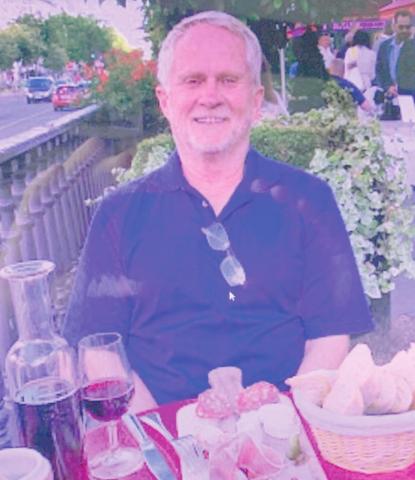 Lawrence Ragan at a sidewalk cafe in Paris