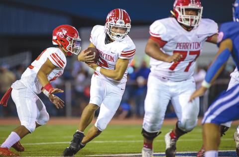 RANGERS FALL TO BOBCATS Perryton Ranger Stetson Garcia (middle) takes the handoff and looks for a seam during the 3rd quarter against the Childress Bobcats, who took the win with a score of 29-7. Next up, the Rangers will host Caprock for Homecoming. Game time is 7:00 P.M. See story for more information. (Photo courtesy of David Erickson)