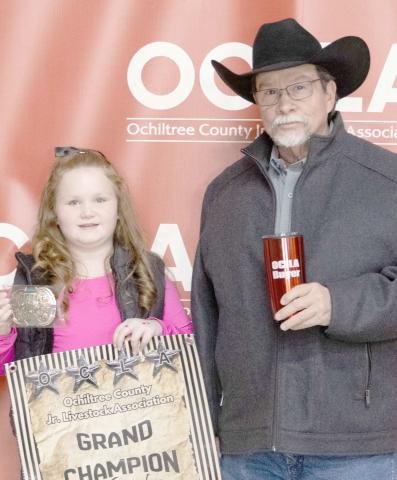 The award for Grand Champion Goat at the Ochiltree County Junior Livestock Show and Sale on Jan. 16-17 went to Bryar Herod. The animal was purchased by Lone Star Ag. Pictured from left are Bryar Herod and Keith Come. ( Photo credit: Hailey Clark of Hailey Renee Photography)