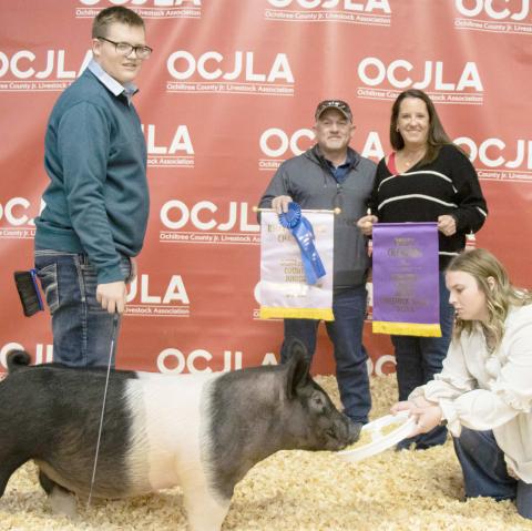 RESERVE GRAND CHAMPION SWINE— The award for Reserve Grand Champion Swine at the Ochiltree County Junior Livestock Show and Sale went to Landry Anderson. The animal was purchased by Hansford County Vet and Hansford County Vet Supply. Pictured from left are Landry Anderson, Tod and Kris Keeth, and Raylee Murry. ( Photo credit: Tessa Powell)
