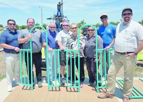 NEW PLAYGROUND UNDER CONSTRUCTION— The City of Perryton is in the midst of installing a new playground at Murphy Park, with a goal of having the site completed by next week. City staff, members of the Parks Advisory Board, and members of the Perryton City Council turned out Tuesday afternoon to check out the playground site. Pictured are, from left, Brady Burdick, J Aston, Kerry Symons, Brad Herring, Mary Dudley, Lynette Fossand, Brad Kile and Brandan Knapp.