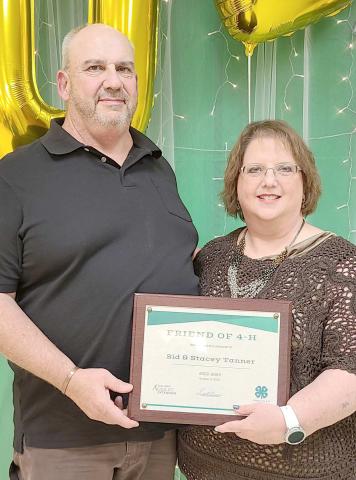 FRIENDS OF 4-H— During the annual awards ceremony for Ochiltree County 4-H at the Expo Center on Monday night, awards were presented for Friends of 4-H for individuals and businesses that go above and beyond to support 4-H programs with donations of time and material resources. Award winners included, from left, Sid and Stacey Tanner. Not pictured is Perryton Herald reporter Scott Slemmons.