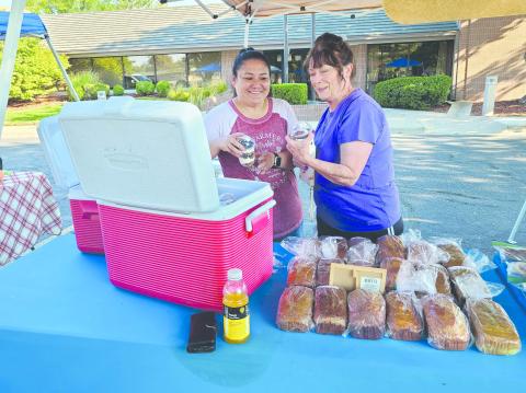 Local residents have been turning out for the Ochiltree County Farmers Market every Saturday for their pick of farm-fresh vegetables, homemade bread and pastries, handmade crafts and quilts, and much more. Pictured are, from left, Rene Schwalk and Penny Clark picking out some new treats to enjoy. The last day of the market will be this Saturday, Sept. 14.