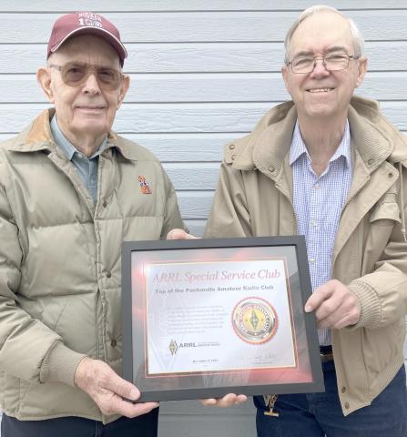 TOPARC MEMBERS RECOGNIZE CLUB FOUNDERS— Members of the Top of the Panhandle Amateur Radio Club (TOPARC) met recently to celebrate the club’s 50th anniversary. Hugh Barton, at left, and Jerome Doerrie were recognized as the founders of the organization.