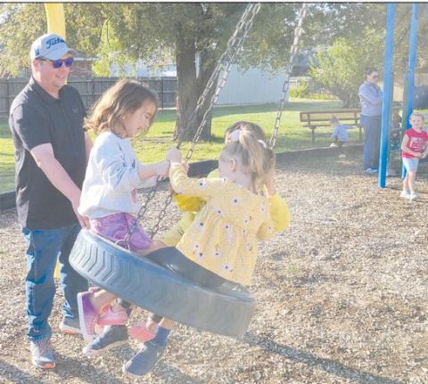 SWINGING IN THE TIRE SWING