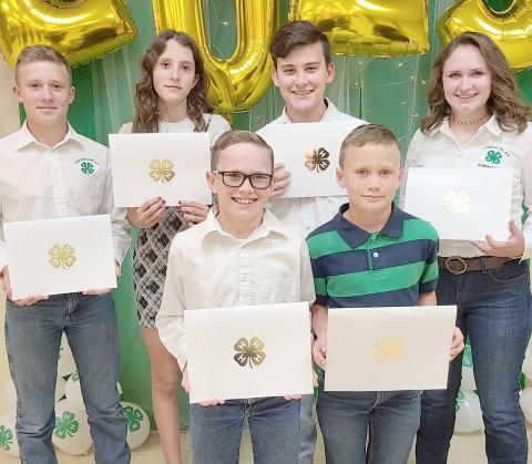 4H 150 POINT AWARDS— Ochiltree County 4-H held its annual awards ceremony Oct. 9 at the Expo Center. Members who accumulated 150 points or more received a certificate and the Donnie Pshigoda Points Scholarship, a $75 scholarship, sponsored by the Ochiltree County Soil and Water Conservation District in honor of Donnie Pshigoda. Pictured are, from left, front row, Clay Oquin and Brady Oquin; and back row, Kyle Oquin, Brooke Helker, Kile Merrick, and Rylan Oquin. Not pictured is Canon Huddleston.