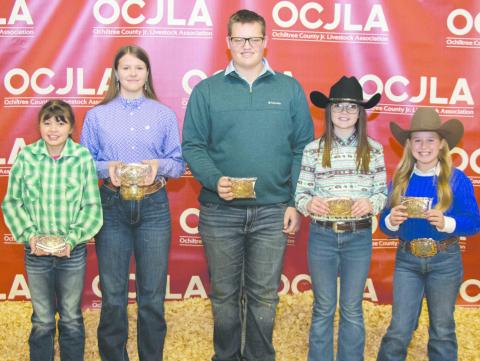 RESERVE GRAND CHAMPION WINNERS— The Reserve Grand Champion winners were presented with their buckle awards at this year’s Ochiltree County Junior Livestock Show and Sale on Jan. 19-20. Pictured are, from left, front row, Chloe Richardson (Reserve Grand Champion Sheep), Tana Williams (Reserve Grand Champion Heifer), Landry Anderson (Reserve Grand Champion Swine), Amelia Jumper (Reserve Grand Champion Goat), and Lakyn Boxwell (Reserve Grand Champion Steer). (Photo Credit: Tessa Powell)