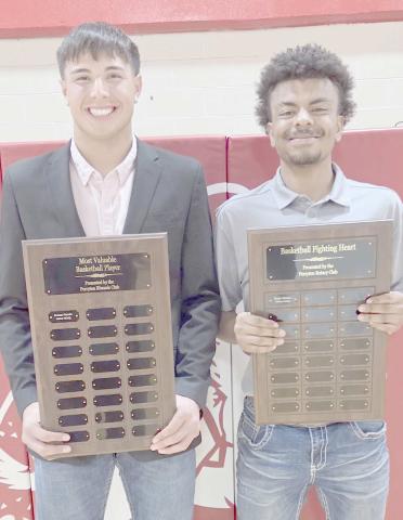 BOYS HOOPSTERS BRING HOME AWARDS— Perryton High School’s boys basketball team was honored at the Perryton High School All Sports Awards Banquet. Pictured are, from left: Avaun Garcia, who brought home the boys MVP award, and Nasir Martin, winner of the Fighting Heart award.