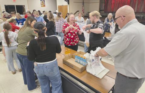 Local volunteers for Snack Pak 4 Kids gathered Monday evening at Williams Intermediate Elementary School to pack snacks for hungry kids. Volunteers meet every few weeks to pack snack bags with nutritious food to help food-insecure students stave off hunger. Volunteers include students from Perryton High School, local business employees, church groups, and people who just want to help.