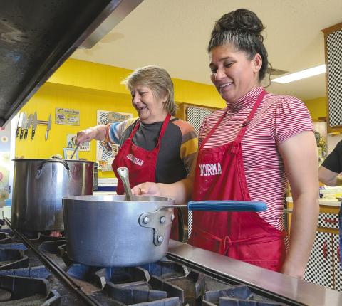 CHOW IS SERVED Perryton’s Senior Citizen Center is still cooking and serving their popular lunches three times a week. Pictured cooking up lunch on Friday were, from left, Nancy Cain and Norma Gonzalez. Menus for the center’s lunches appear in Senior Center director Daryla Allred’s column every week.