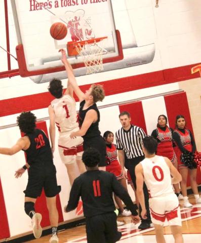 RANGERS FACE BORGER – Daxton Rigdon, #1, drives to the bucket and scores during Tuesdays game against the Borger Bulldogs. See story for more information.
