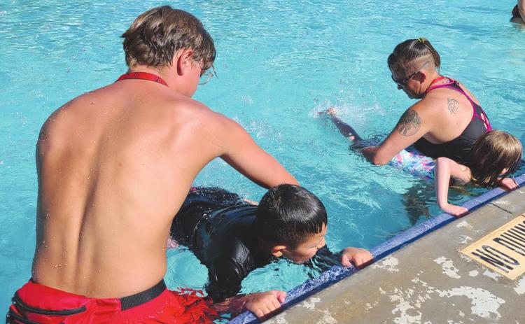 SWIMMING IS A KICK