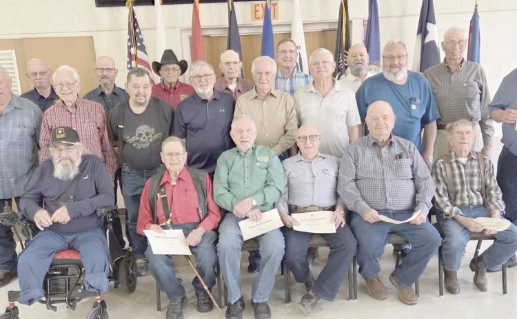 DAR HONORS VIETNAM VETS—The Wolf Creek Chapter of the National Society Daughters of the American Revolution commemorated National Vietnam War Veterans Day on March 29 by recognizing and honoring local veterans of the Vietnam War during their regular meeting in March. Pictured are, from left, front row: Danny Cash, Neal Davis, Byerl Bates, Stan Luck, Bobby Kile, and Dale Herring; second row: Randy Redmon, Senn Slemmons, Richard Cornelius, Keith Whitely, Doug McGarraugh, Merle Davis, and Freddy Bohannon;