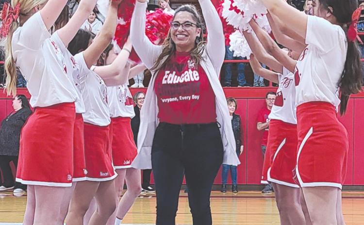 A TRIBUTE TO TEACHERS AND STUDENTS Perryton Junior High held a pep rally Monday to celebrate the school’s improved academic status, as it earned an official “Acceptable” rating from the Texas Education Agency. Teachers and students at PJH were congratulated by PISD administration staff, school board members, and representatives from TEA and the Region 16 Service Center. Pictured running through the PJH cheerleaders’ pom-pom tunnel is English teacher Maribel Murillo.