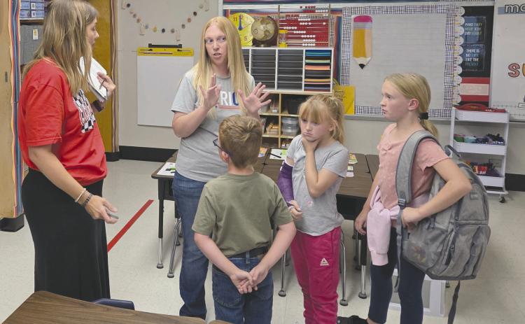 As Perryton Independent School District welcomed students back for another year at school on Wednesday, teachers and staff used the first half of the week to make final preparations for the year and to hold “Meet the Teacher” events to students and parents could get to know their new teachers one-on-one. Pictured at the Meet the Teacher event at Wright Elementary on Monday are, from left, first grade teacher Marci Kirklin, Melissa Meyer, Marshall Meyer, age 6, Madison Meyer, 9, and McKenzie Meyer, 11.