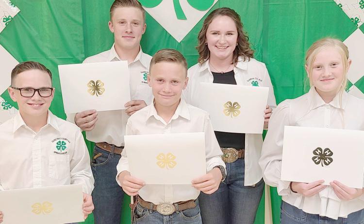 150 POINT AWARDS— Ochiltree County 4-H held their annual awards ceremony Monday night at the Expo Center. Members who accumulated 150 points or more received a certificate and the Donnie Pshigoda Points Scholarship, a $75 scholarship, sponsored by the Ochiltree County Soil and Water Conservation District in honor of Donnie Pshigoda. Pictured are, from left, front row, Clay Oquin, Brady Oquin, and Hannah Young; and back row, Kyle Oquin and Rylan Oquin.