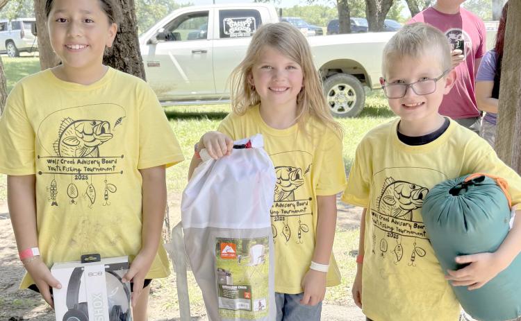 Enthusiastic young fishing fans came out for the Children’s Fishing Tournament at Lake Fryer and Wolf Creek Park at the beginning of June. Pictured are, from left, the top winners in the category for kids ages 7-10, Juliana Becerril (first place), Kinzie Anderson (second place), and Levi Nelson (third place).