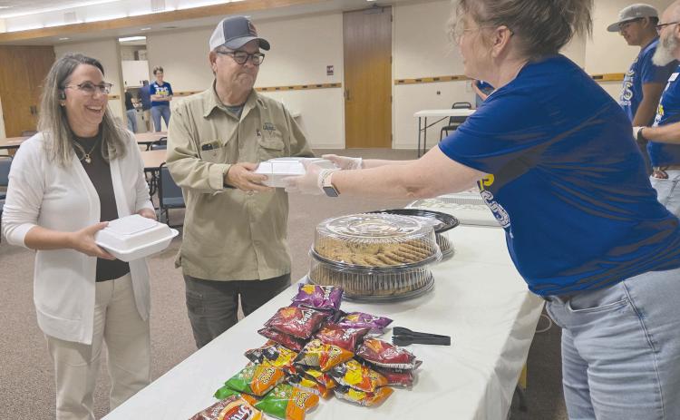 Frank Phillips College, Allen Campus hosted a pulled pork dinner fundraiser Tuesday evening for the Perryton Pathways scholarship program. Hungry diners had dine in, take out, and delivery options available, as well as a silent auction. Pictured are Phil and Lori Dollar picking up their meal from volunteer Misty Stockton. Pathways is open to PHS freshmen and eligible sophomores, juniors, and seniors.