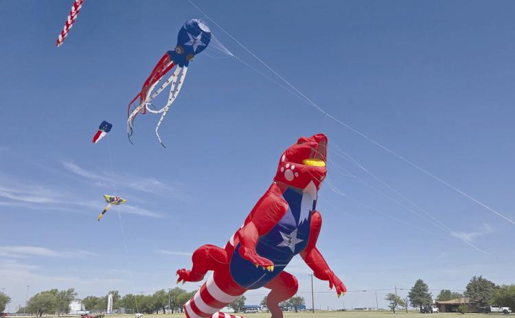 GIANT DINOSAURS IN THE PARK— Perryton saw a gigantic celebration on July 4 at Leatherman Park. In addition to a car show, farmers market, multiple contests and concerts, food trucks, and fireworks, Kites in the Field over Texas brought the spectacle to the celebration with gigantic inflatable kites, including this tremendous floating dinosaur.