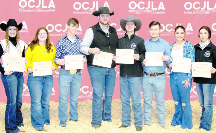 OCJLA SCHOLARSHIP RECIPIENTS—Eight students were awarded scholarships during the Ochiltree County Junior Livestock Show and Sale on Jan. 19-20. Pictured are, from left, Maddie Schickedanz, Karson Pribble, Bradie Flaming, Evan Born, Treven McKinley, Kile Merrick, Alana George, and Addison Miller Cook. Not pictured is Savanna Pshigoda. (Photo credit: Tessa Powell)