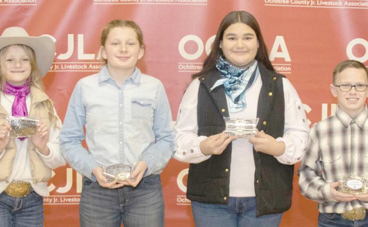 JUNIOR CHAMPION SHOWMANSHIP WINNERS—At the Ochiltree County Junior Livestock Show and Sale, the Junior Champion Showmanship Awards were presented to participating students. Pictured are, from left: Sydney Schickedanz, Addilynn Reihm, Saraelee Pshigoda, and Clay Oquin. (Photo credit: Tessa Powell)