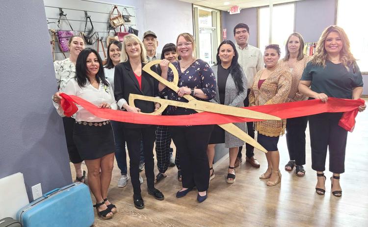 RIBBON-CUTTING HELD AT RESALE STORE – Members of the Perryton-Ochiltree Chamber of Commerce, along with staff, board members, and other well-wishers were on hand on July 22 for a ribboncutting ceremony for the Panhandle Crisis Center’s Resale Store at 301 S. Ash in Perryton. The Resale Store, which sells clothing, housewares, and other goods, helps support the Crisis Center’s projects and services.