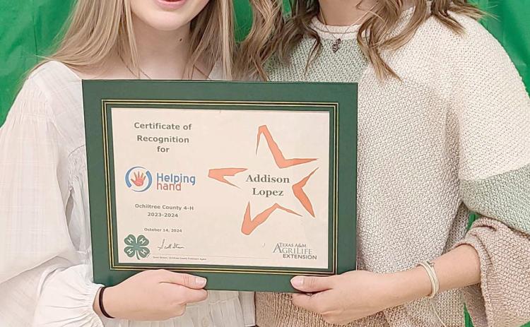HELPING HAND WINNER—Ochiltree County 4-H held their annual awards ceremony at the Ochiltree County Expo Center on Oct. 14. Addison Lopez was recognized with the Helping Hand Award, which honors a 4-H member who has worked to serve other 4-H members in projects and events. Pictured are, from left, presenter Emmalee Lopez and winner Addison Lopez.