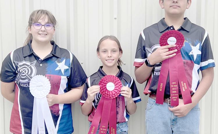 4-H ARCHERS COMPETE AT TRI-STATE FAIR—Students participating in Ochiltree County 4-H’s archery program competed in the Tri-State Fair’s archery competition on Monday, Sept. 15, in Amarillo. There were 40 archers competing in the contest, with ten of those coming from Ochiltree County. Pictured are, from left, Grace Hampton, who won third overall in Recurve Senior, Gabrielle Heck, who took reserve in Recurve Junior, and Ethan Flores, who was reserve in Recurve Senior.