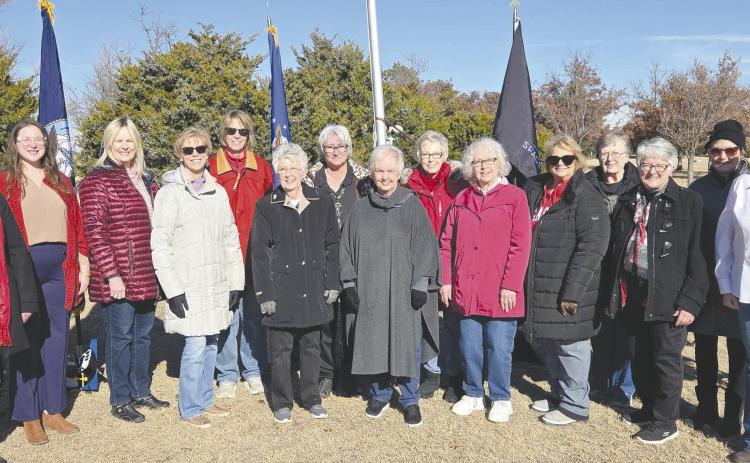 DAR HOLDS WREATHS ACROSS AMERICA EVENT—Ochiltree County once again participated in the nationwide “Wreaths Across America” ceremony at Ochiltree Cemetery. The event is sponsored by the Wolf Creek Chapter of the National Society Daughters of the American Revolution. Pictured are DAR members, from left: Sherrie Rima, Grace Gaertner (who performed the National Anthem) Ruth Ann Noe, Ann Haley, Nan Cook, Cynthia Shattles, Debra Dye, Carol McGarraugh, Barbara Johnson, Kay McGarraugh, Nan Schwalk, Lou Ann Slemmons
