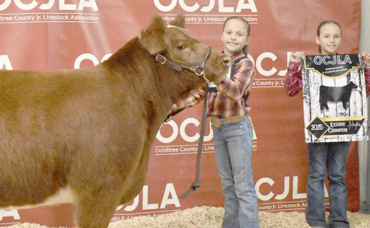 At the Ochiltree County Junior Livestock Show and Sale on Jan. 17-18, the prize for Reserve Grand Champion Heifer went to Izzy Heck. Pictured are, from left, Izzy Heck and Gabby Heck. ( Photo credit: Morgan Dudley)