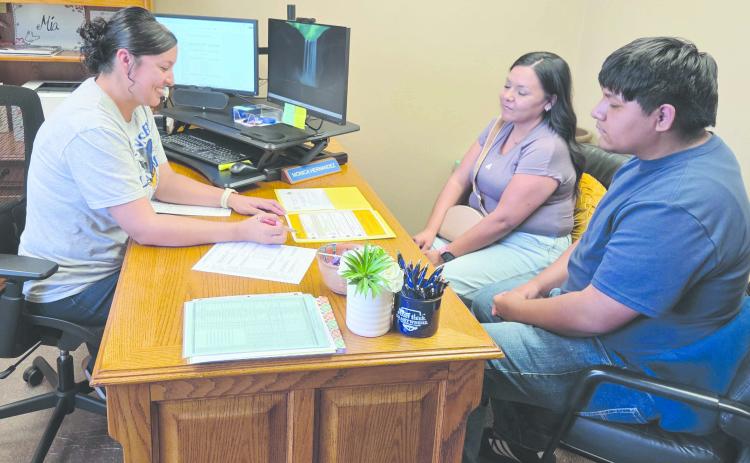 Frank Phillips College, Allen Campus held an open house on Monday evening. Visitors met campus staff, toured the campus, met with advisors, and got help with applications for admission and financial aid forms. Pictured reviewing some campus documents are, from left, academic coordinator Monica Hernandez, Bianna Ontiveros, and Aiden Ontiveros.