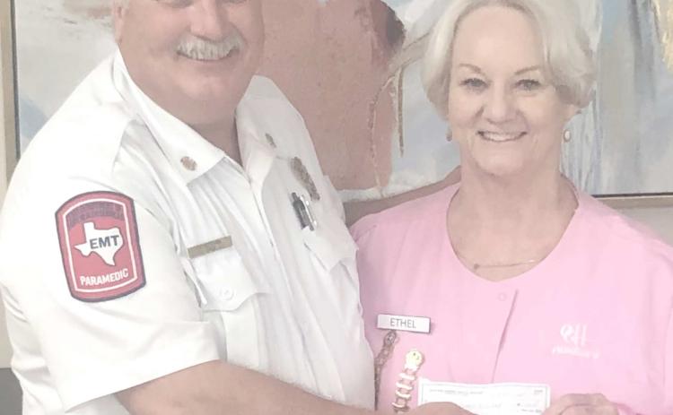 The Ochiltree General Hospital Auxilliary presented a donation of $1,000 to the volunteer fire department during their meeting at the Senior Citizen Center on April 1. Pictured are Perryton Fire Chief Paul Dutcher and Hospital Auxiliary president Ethel Rudd.