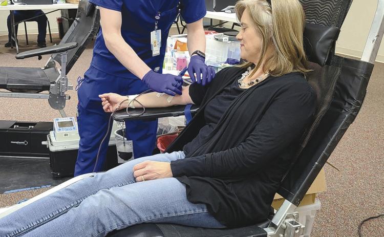 Coffee Memorial Blood Center in Amarillo held a blood drive on Tuesday afternoon at Frank Phillips College, Allen Campus. The drive had a goal of 40 units of blood, but was only able to collect 28 units. A total of 38 people showed up for the drive, but 10 of those were deferred. Pictured are, from left, Coffee phlebotomist Brandon Martinez and donor Nicole Huddleston.