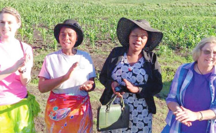 Kamber Burleson Henson, two Lesotho residents and Carolyn Thurman
